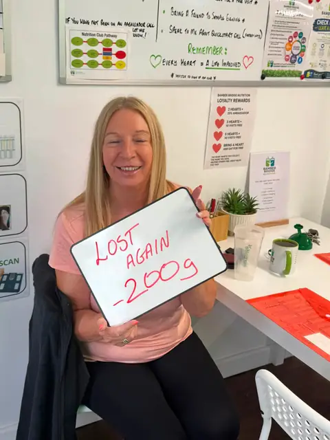 A Bamber Bridge Nutrition club member with her assessment board