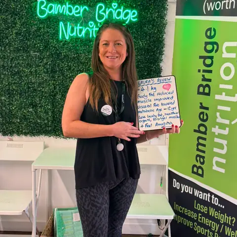 A Bamber Bridge Nutrition club member with her assessment board