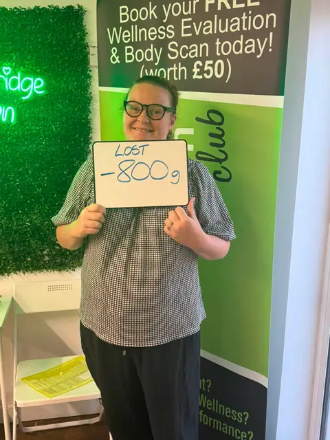 A Bamber Bridge Nutrition club member with her assessment board