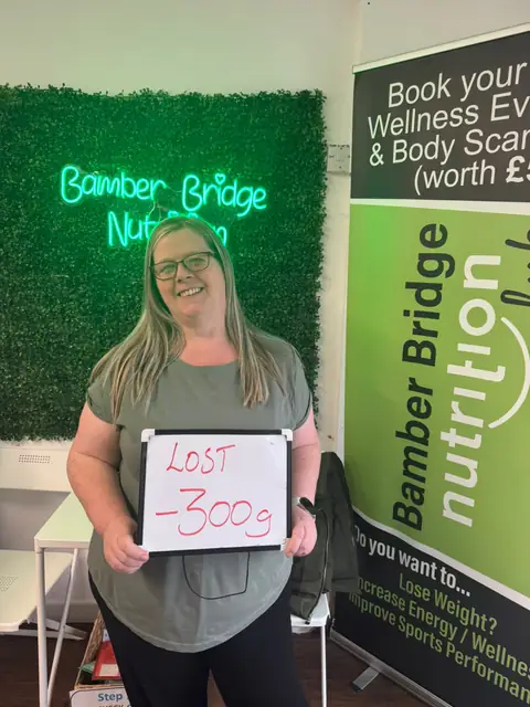 A Bamber Bridge Nutrition club member with her assessment board