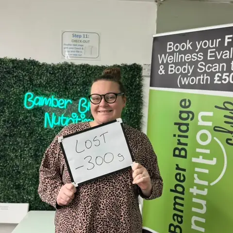 A Bamber Bridge Nutrition club member with her assessment board